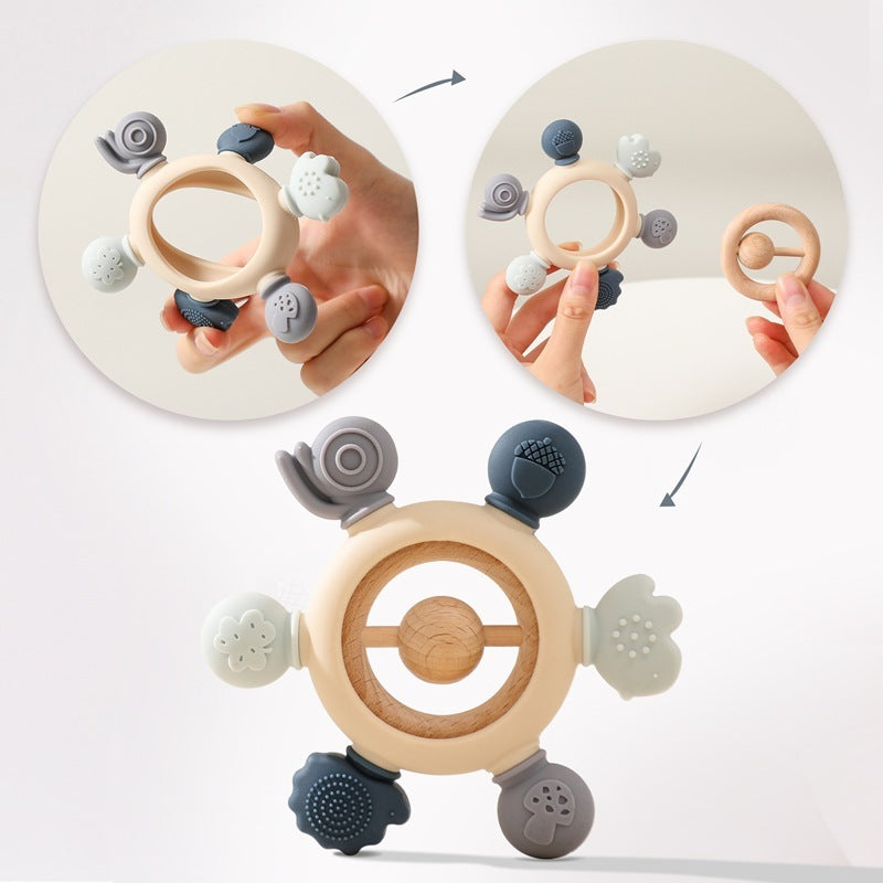 MimiAnneau silicone and wood baby teething ring in grey and cream with animal shapes.